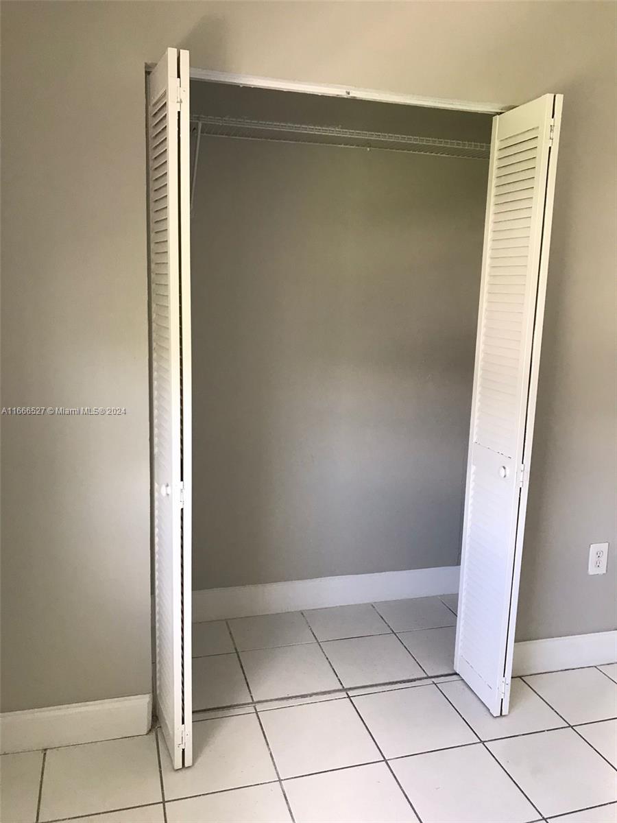 459 Northeast 210th Cir Terrace, Unit 20117 Miami, FL 33179 - Photo 13 of 33 a view of an empty room