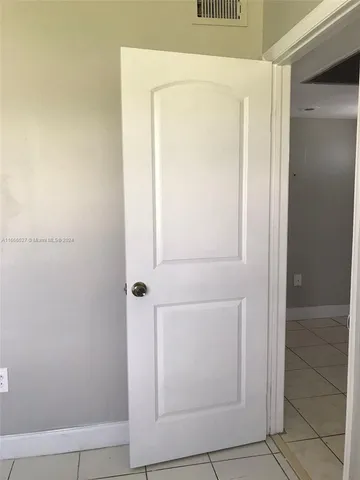 a kitchen with a sink and stainless steel appliances