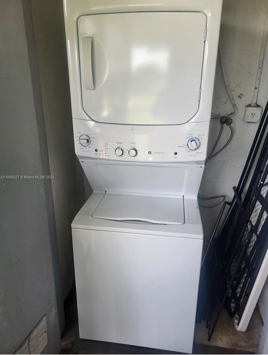 459 Northeast 210th Cir Terrace, Unit 20117 Miami, FL 33179 - Photo 25 of 33 a close up view of washer and dryer