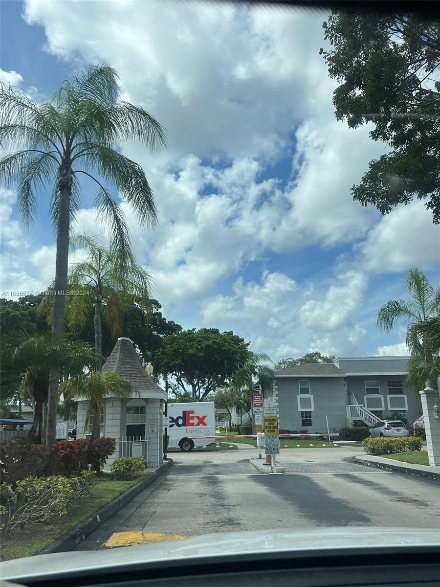 459 Northeast 210th Cir Terrace, Unit 20117 Miami, FL 33179 - Photo 3 of 33 a view of multiple houses with a yard