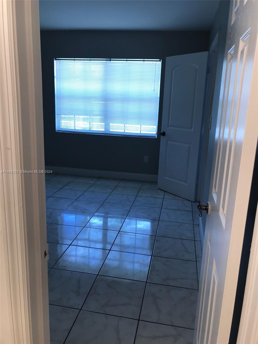 459 Northeast 210th Cir Terrace, Unit 20117 Miami, FL 33179 - Photo 31 of 33 a view of entryway