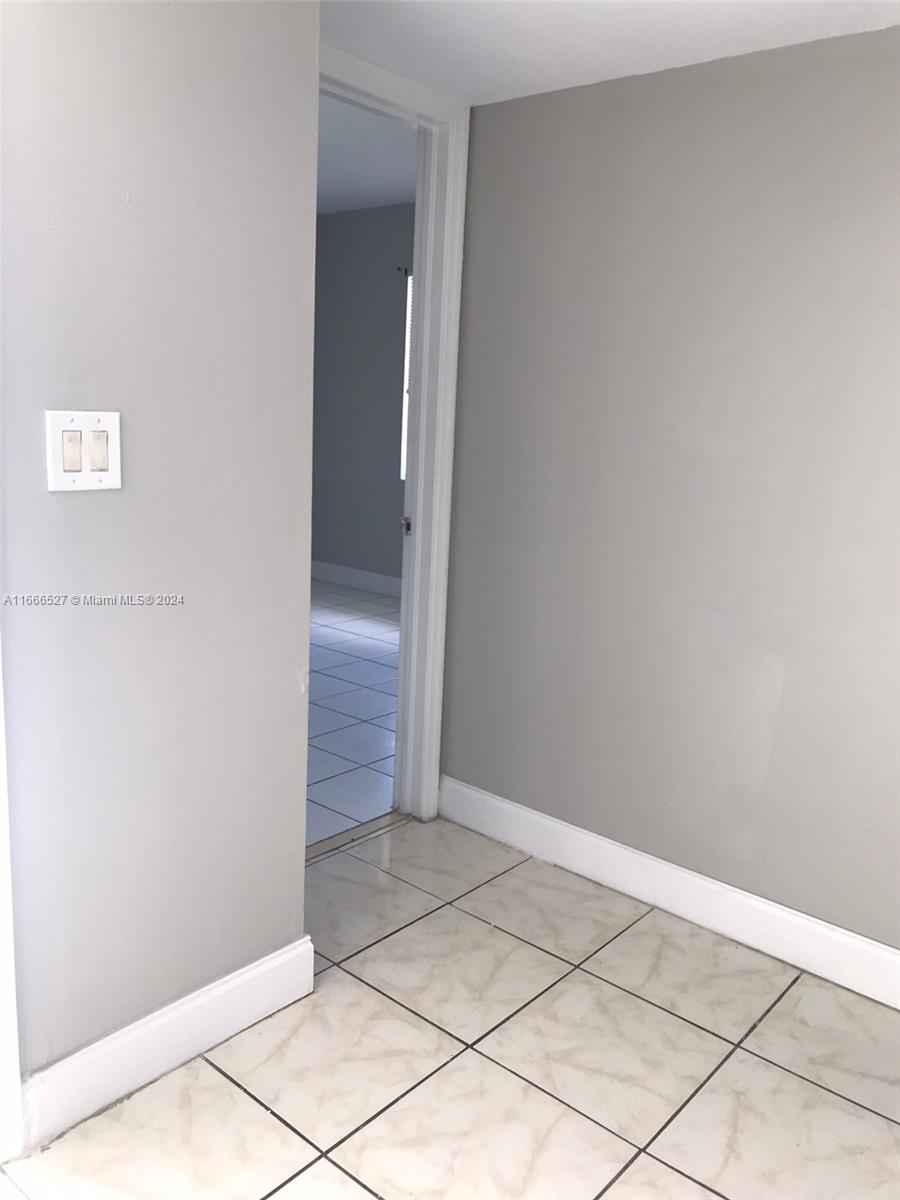 459 Northeast 210th Cir Terrace, Unit 20117 Miami, FL 33179 - Photo 8 of 33 a view of an empty room
