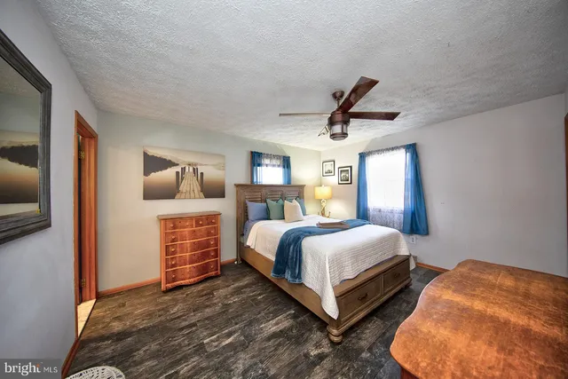 a bedroom with bed and window