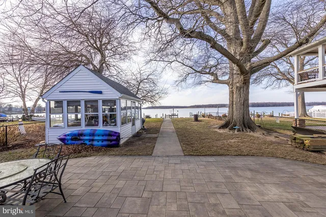 a front view of house with outdoor seating