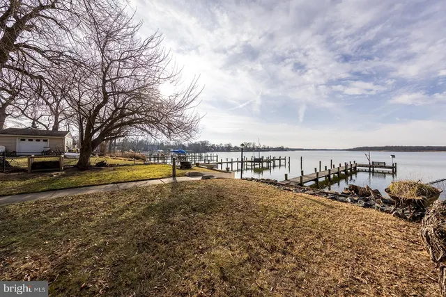 a view of a yard with swimming pool and sitting area