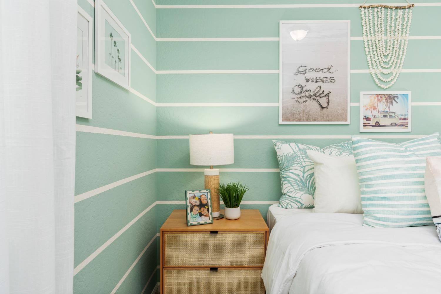 1167 Elevations Way West Madera, CA 93636 - Photo 15 of 28 a bedroom with a bed and a potted plant