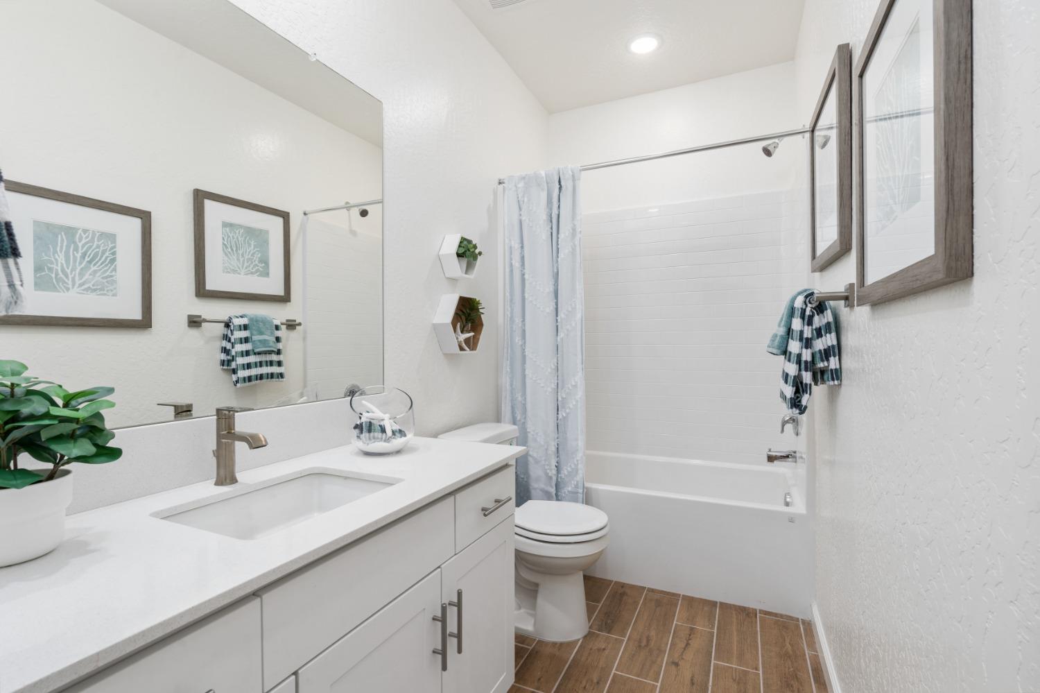 1167 Elevations Way West Madera, CA 93636 - Photo 18 of 28 a bathroom with a sink toilet and shower