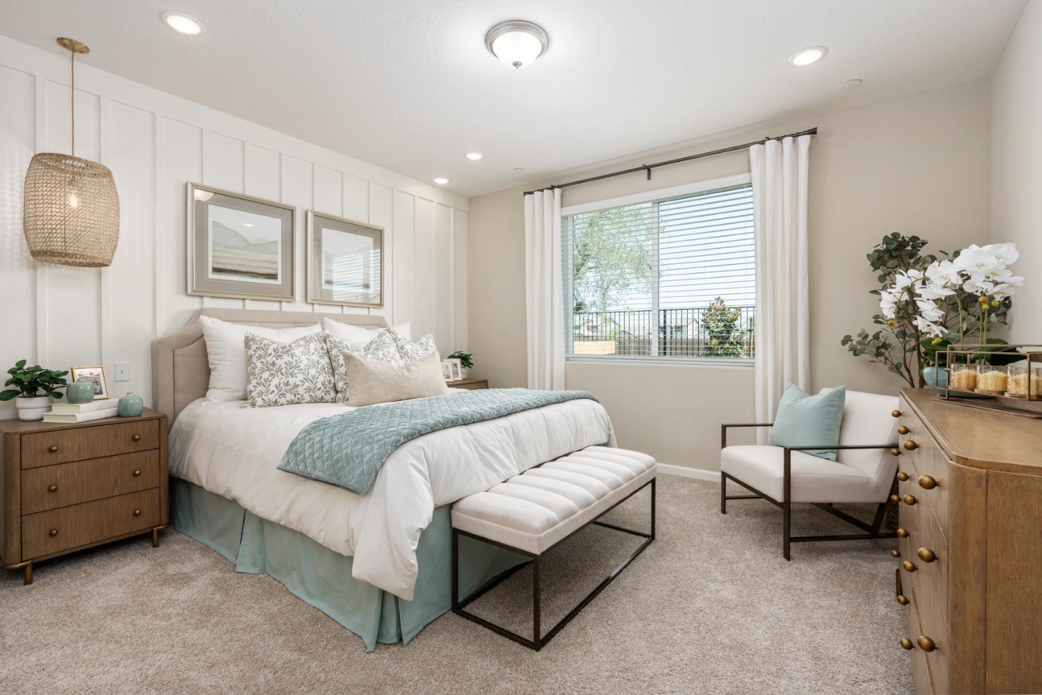 1167 Elevations Way West Madera, CA 93636 - Photo 19 of 28 a bedroom with bed and windows