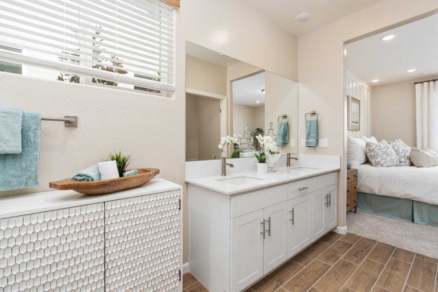 1167 Elevations Way West Madera, CA 93636 - Photo 23 of 28 a bathroom with a sink and a mirror