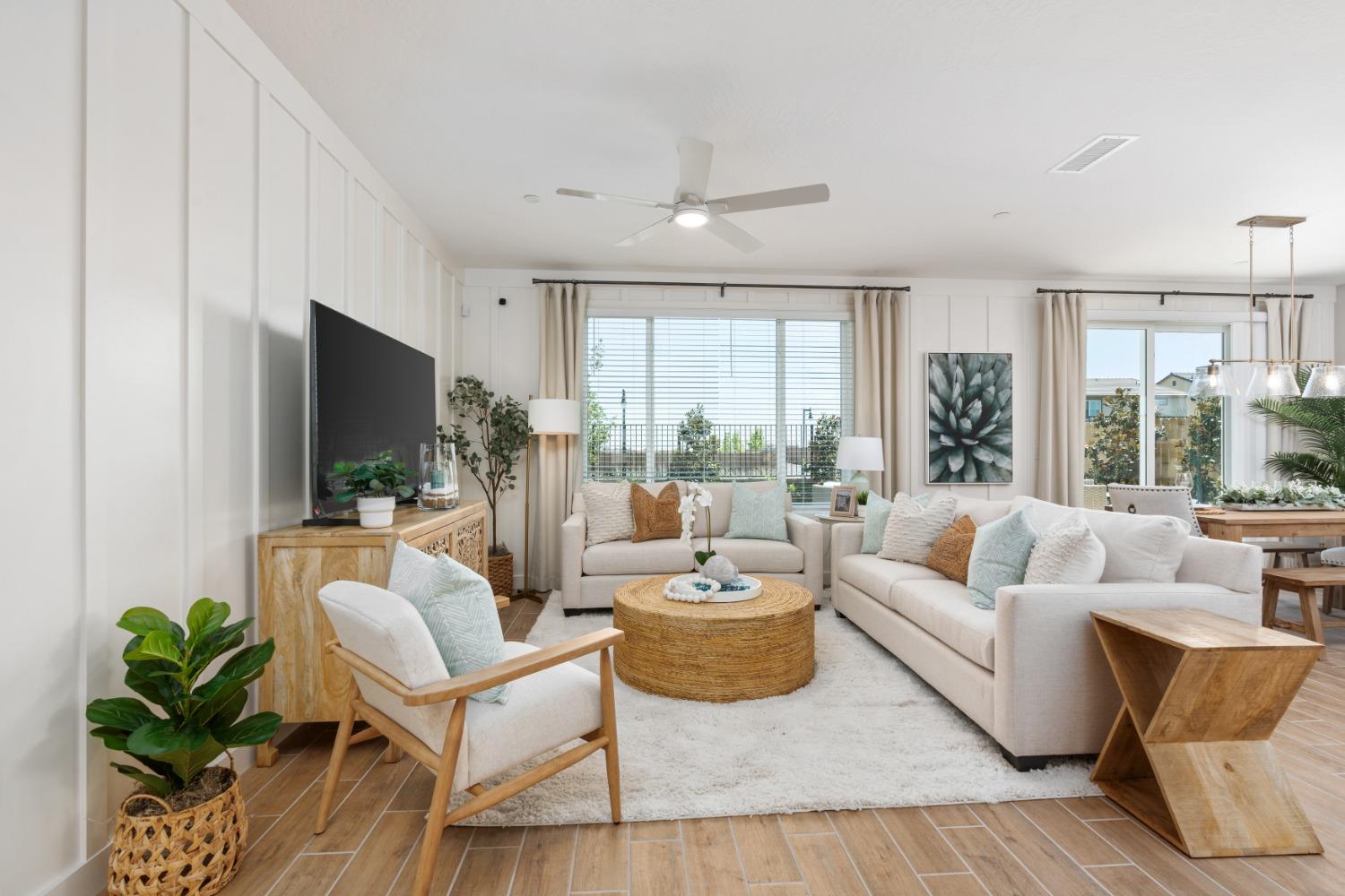 1167 Elevations Way West Madera, CA 93636 - Photo 4 of 28 a living room with fireplace furniture and a flat screen tv
