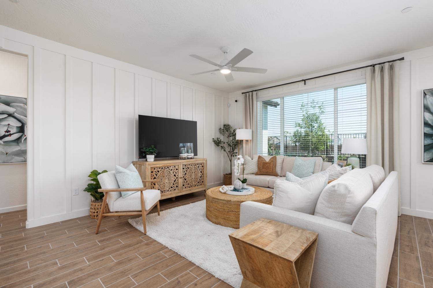 1167 Elevations Way West Madera, CA 93636 - Photo 5 of 28 a living room with furniture and a flat screen tv