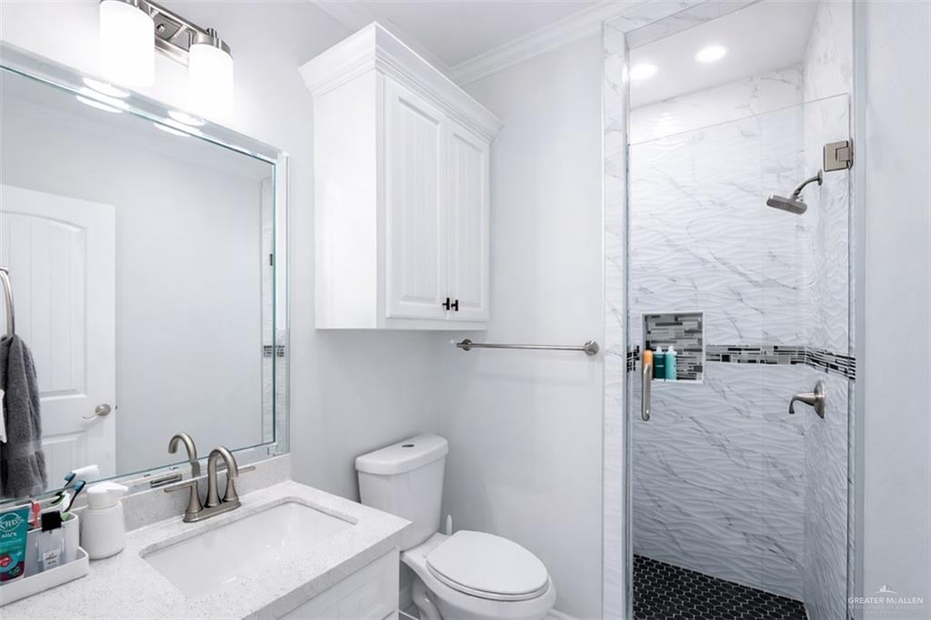 325 Dawn Street Rio Grande City, TX 78582 - Photo 12 of 17 a bathroom with a sink toilet and shower