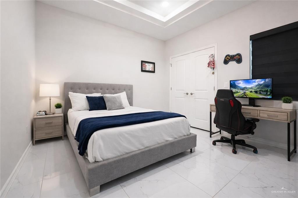 325 Dawn Street Rio Grande City, TX 78582 - Photo 14 of 17 a bedroom with a bed chair and a desk