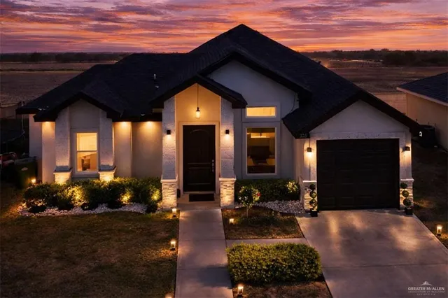 a view of house with patio outdoor seating