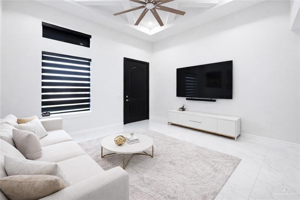 325 Dawn Street Rio Grande City, TX 78582 - Photo 9 of 17 a living room with furniture and a flat screen tv