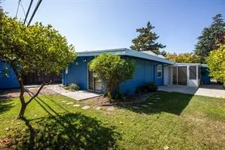 a house view with a backyard space
