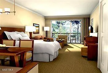 a bed room with a bed and a large window