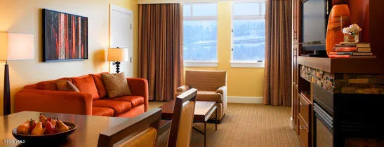 a kitchen with granite countertop a stove sink and microwave