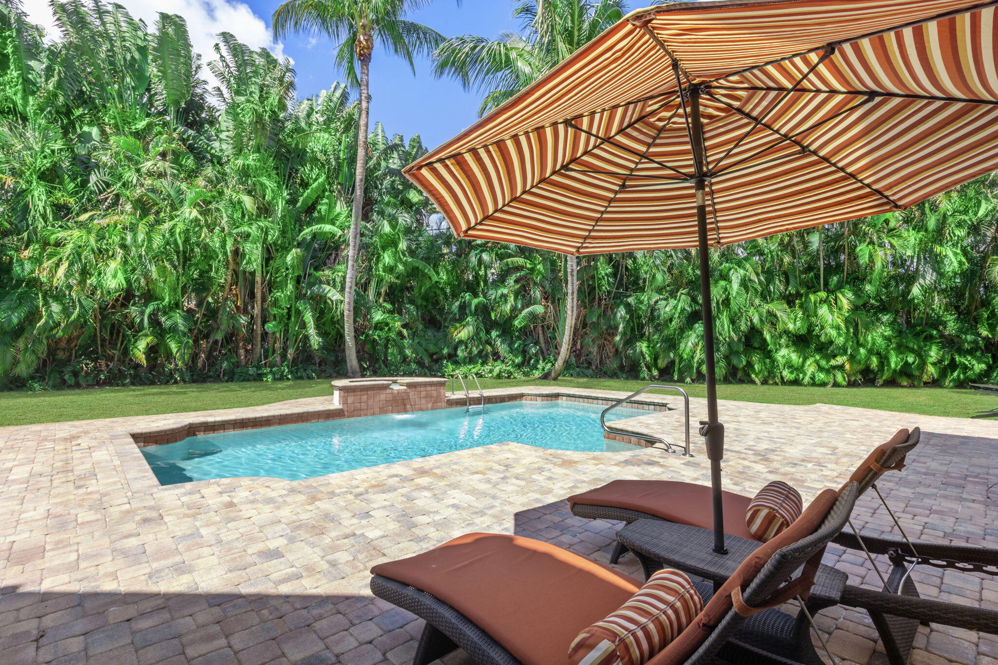 4499 Sanctuary Lane Boca Raton, FL 33431 - Photo 32 of 50 a view of a swimming pool with a patio