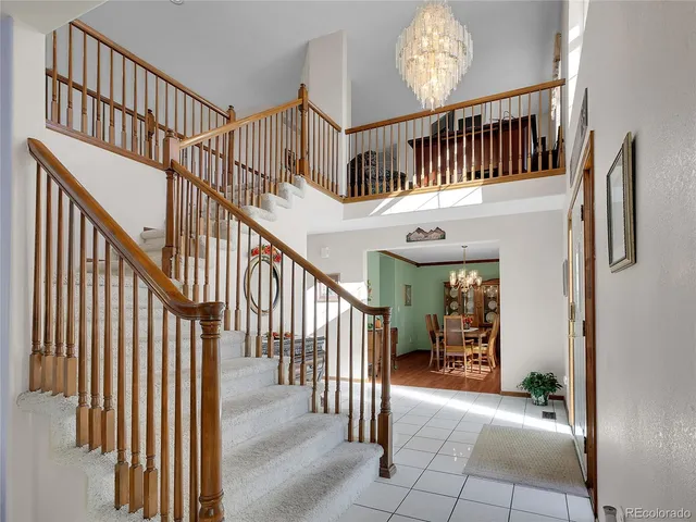 a view of staircase with furniture and stairs