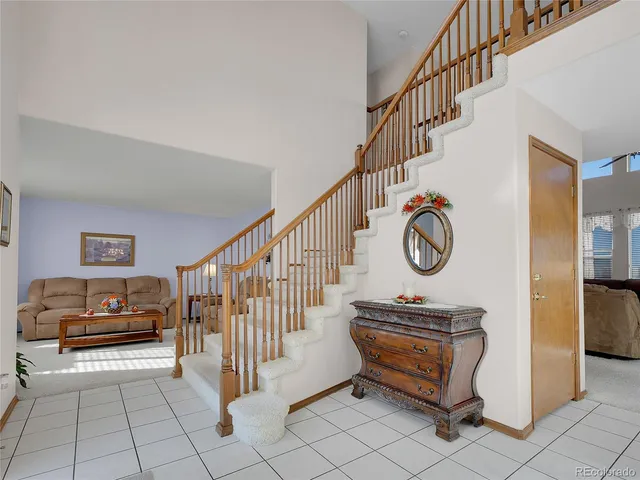 a view of entryway with stairs and furniture