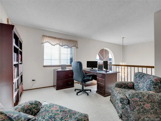 a workspace with furniture and a window