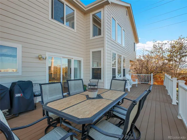 a view of a patio with a table and chairs