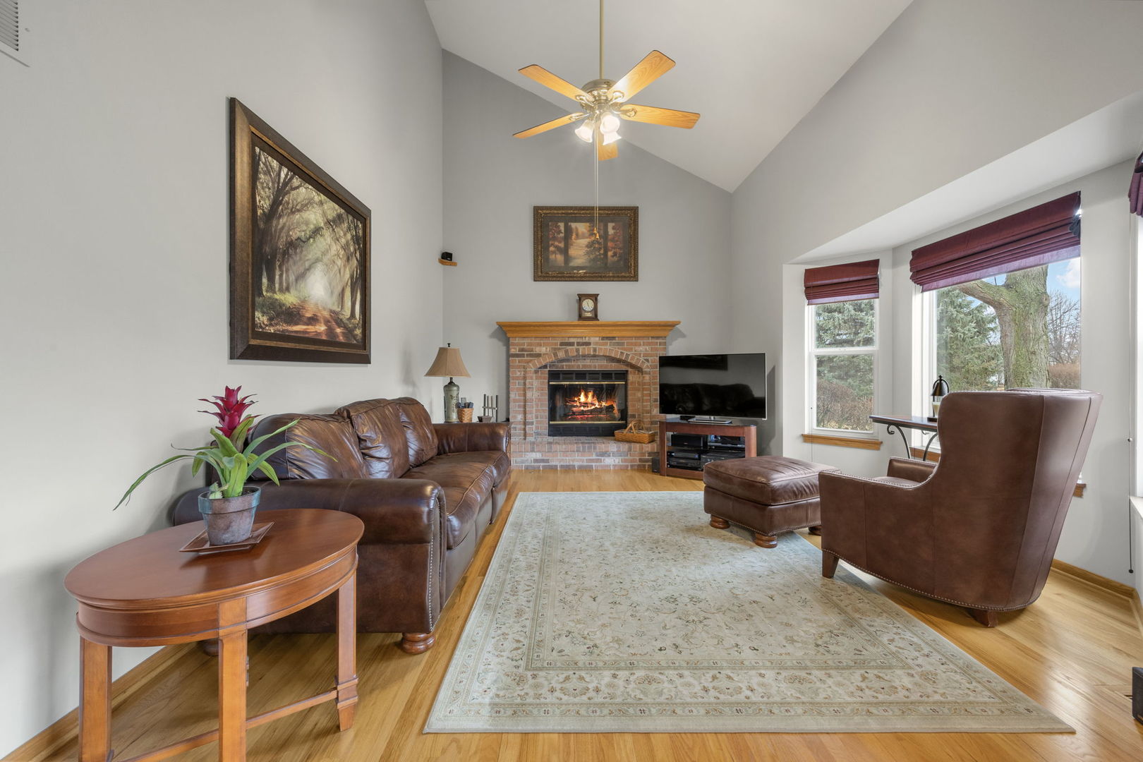 33 Forestview Lane Aurora, IL 60502 - Photo 12 of 27 a living room with furniture potted plant and a fireplace
