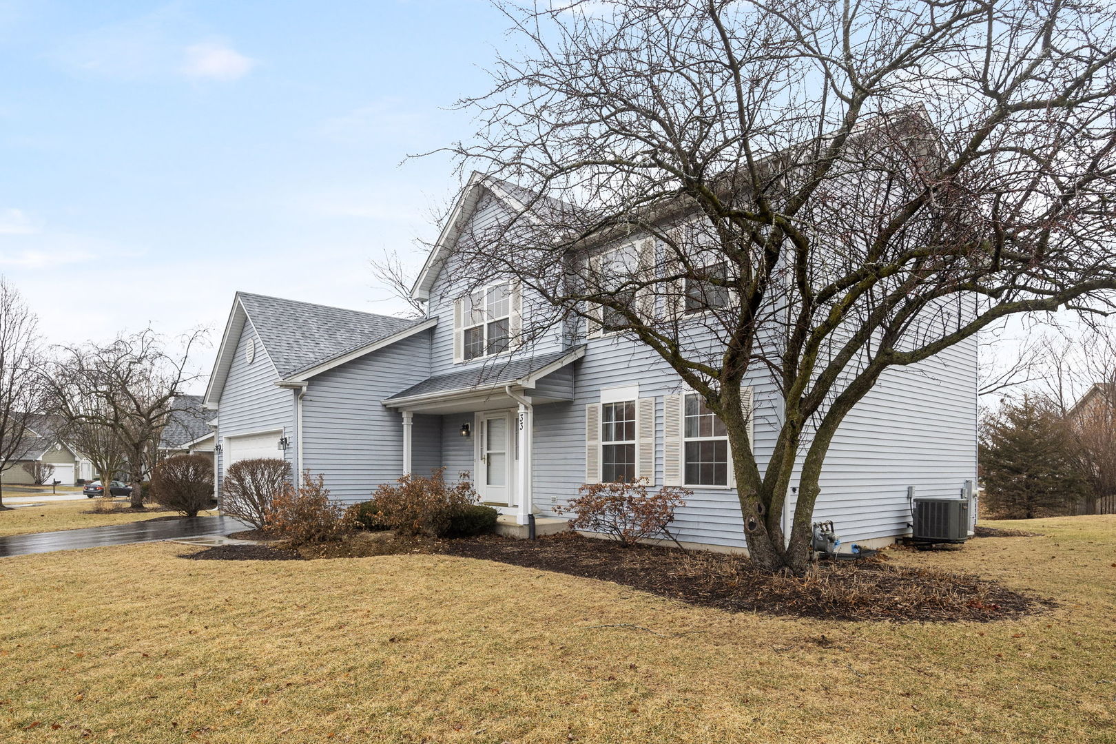 33 Forestview Lane Aurora, IL 60502 - Photo 2 of 27 a front view of a house with a yard covered in snow