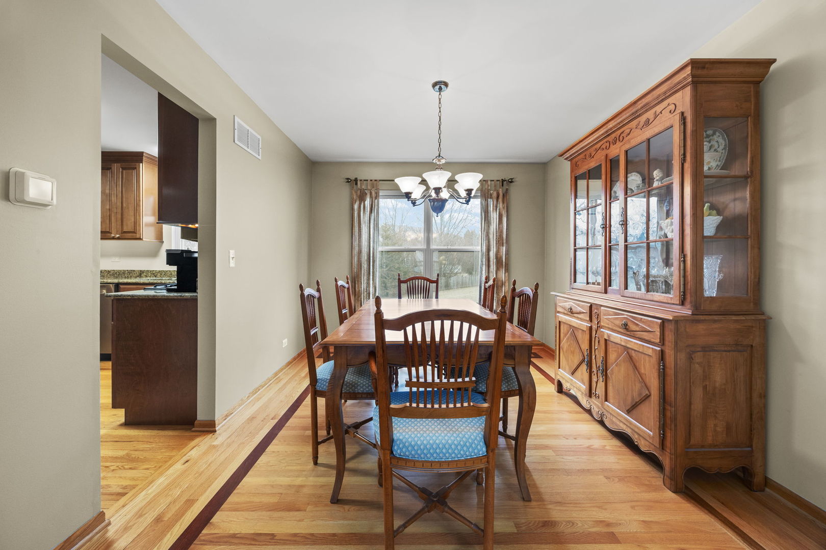 33 Forestview Lane Aurora, IL 60502 - Photo 5 of 27 a view of a dining room with furniture window and wooden floor