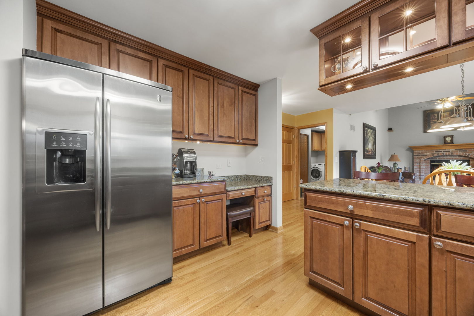 33 Forestview Lane Aurora, IL 60502 - Photo 10 of 27 a kitchen with stainless steel appliances granite countertop a refrigerator a stove and a sink