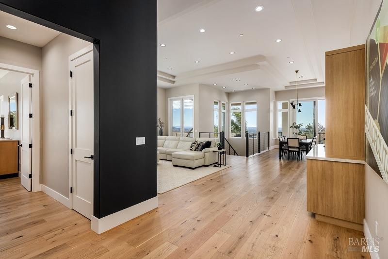 3642 Bellagio Court Santa Rosa, CA 95404 - Photo 4 of 54 This view is as you enter this magnificent home with designer touches throughout. The entrance to the Primary Suite is to the left. This home offers beautiful, engineered wood flooring throughout.