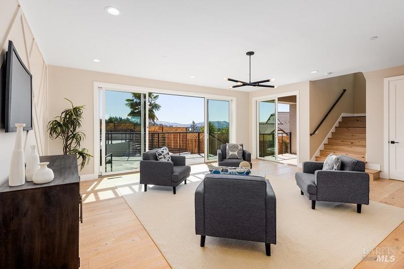 3642 Bellagio Court Santa Rosa, CA 95404 - Photo 49 of 54 Here we are back in the lower-level media room. Large sliding glass doors to the left lead out to the inground pool & spa, and patio areas. The sliding glass door to the right of this photo leads out to the large, covered loggia.