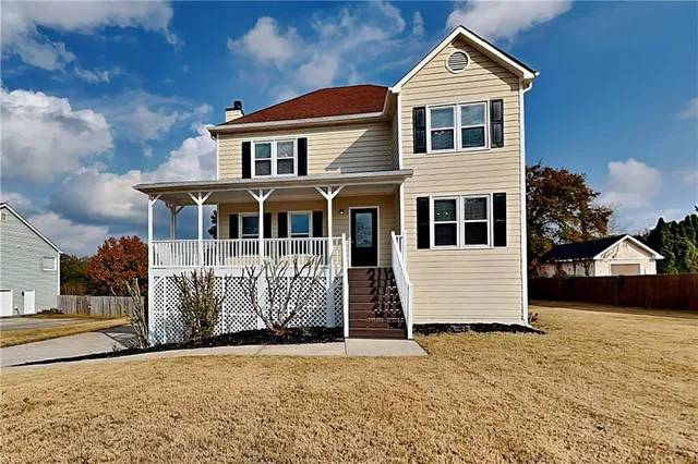 a front view of a house with a yard