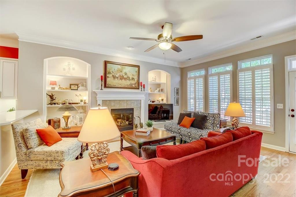 17021 Carlton Way Road Huntersville, NC 28078 - Photo 8 of 27 a living room with furniture a fireplace and a large window