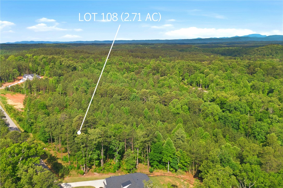 Lot 108 Harbor Ridge Road Seneca, SC 29672 - Photo 6 of 13 This expansive lot offers a canvas for your dream home amidst verdant landscapes and distant mountain views.