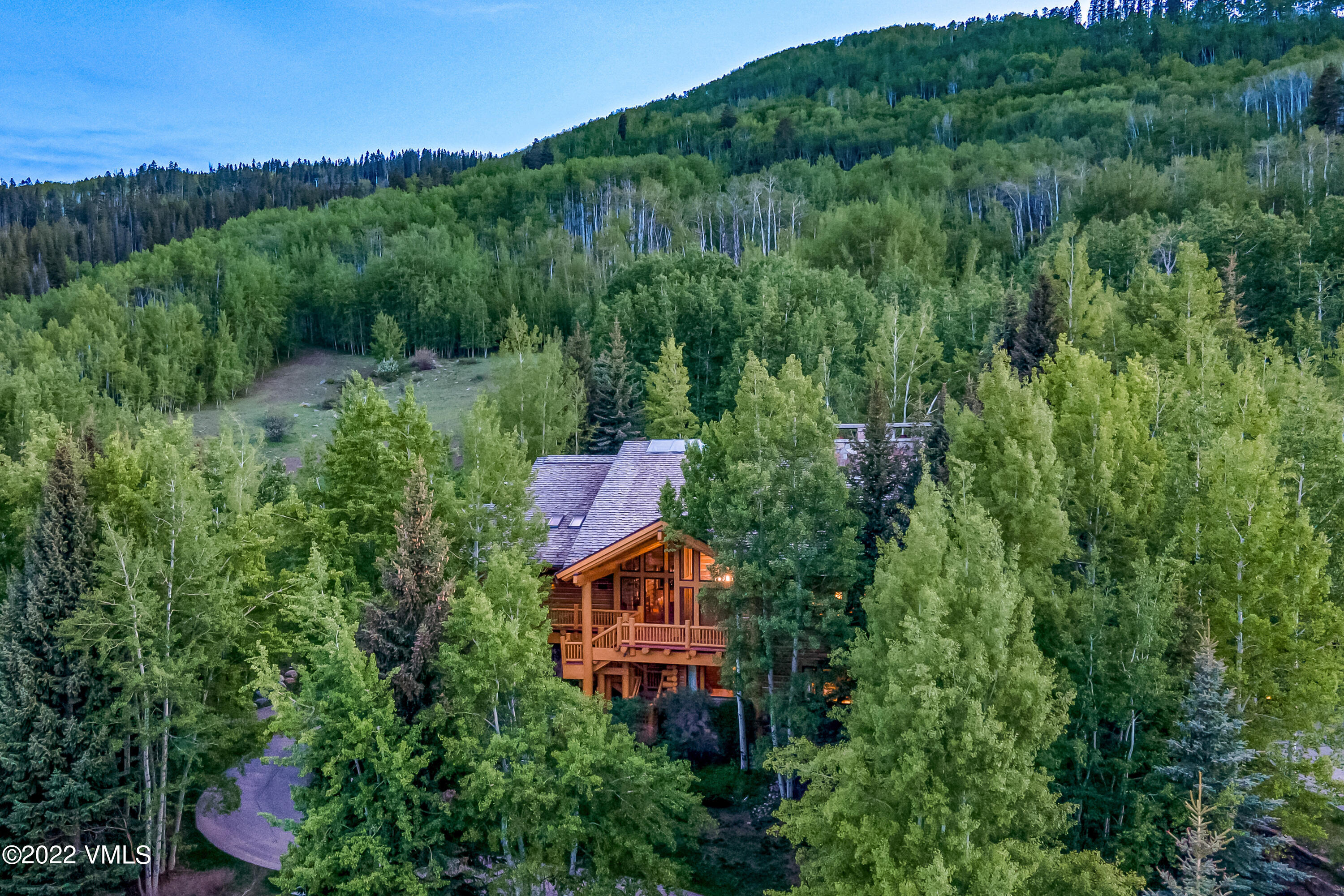 an aerial view of a house with mountain view