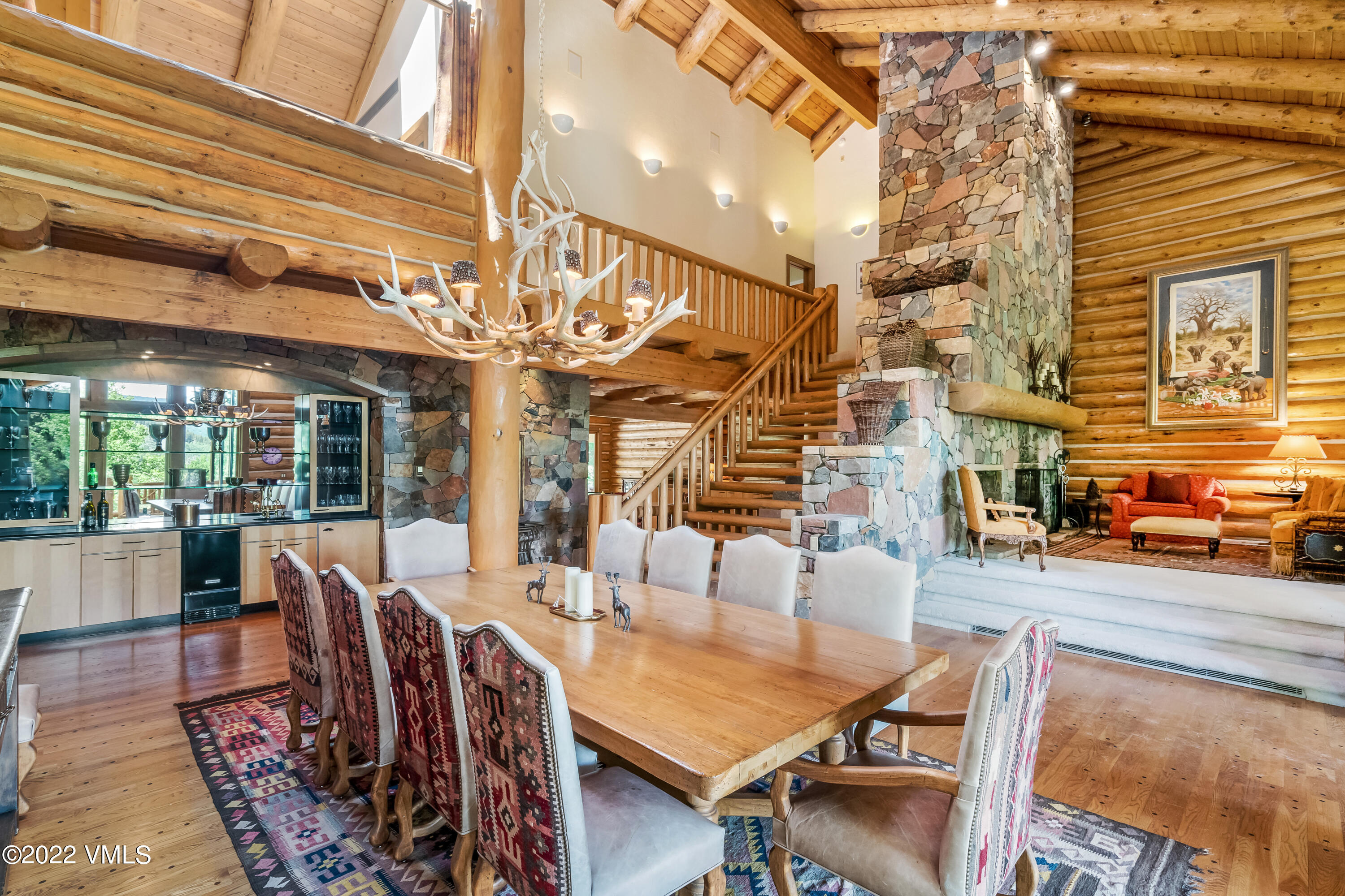 447 Borders Road Beaver Creek, CO 81620 - Photo 21 of 71 a dining room with furniture a chandelier and wooden floor