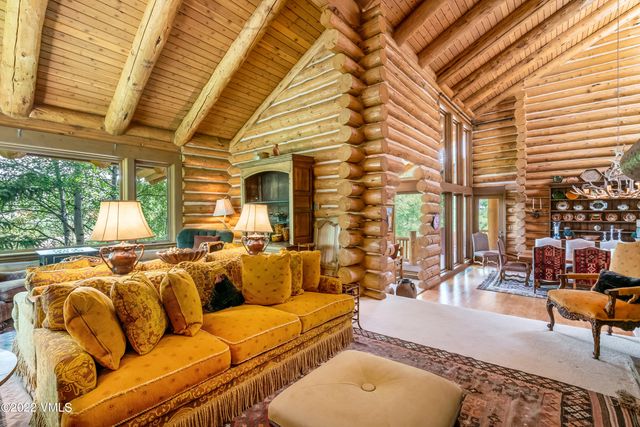 a kitchen with stainless steel appliances granite countertop a sink window and refrigerator