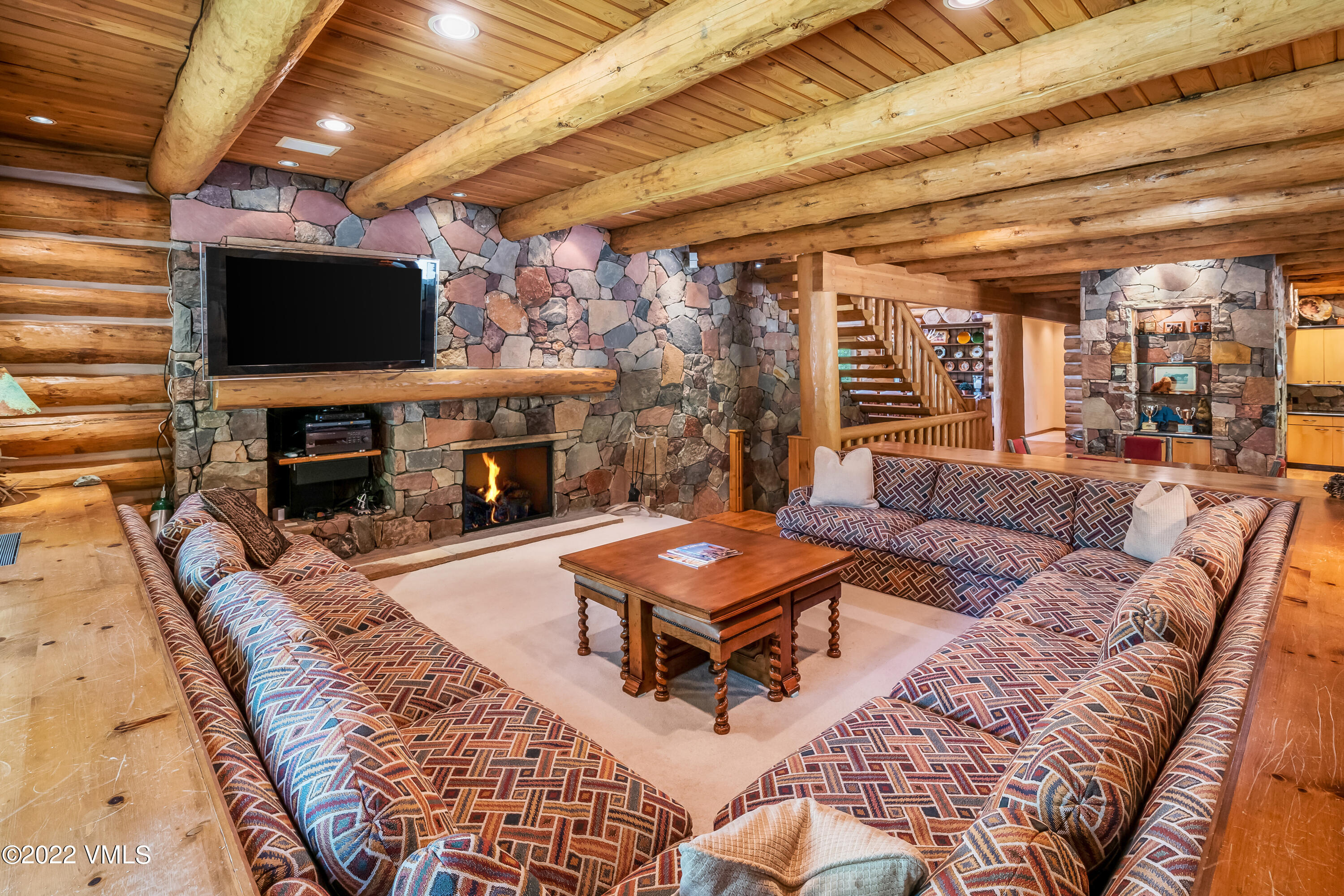 447 Borders Road Beaver Creek, CO 81620 - Photo 26 of 71 a living room with furniture a flat screen tv and a fireplace