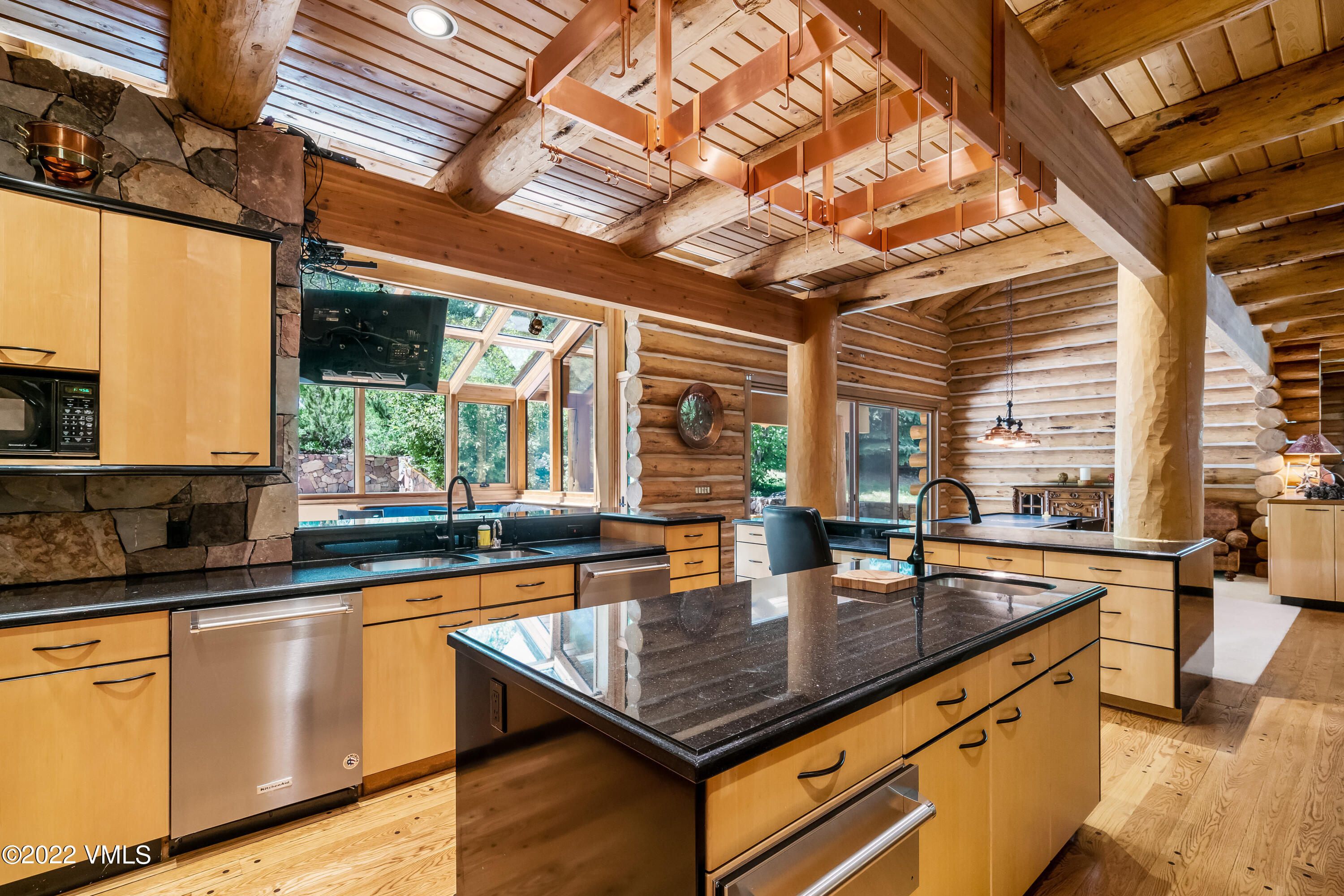 447 Borders Road Beaver Creek, CO 81620 - Photo 30 of 71 a kitchen with stainless steel appliances granite countertop sink stove and cabinets