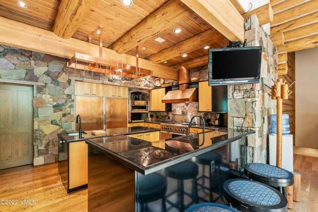 a sitting area with wooden racks