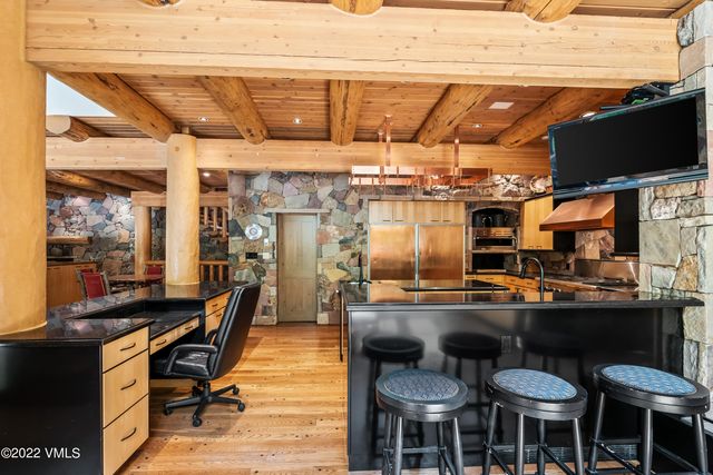 a view of workspace with wooden floor