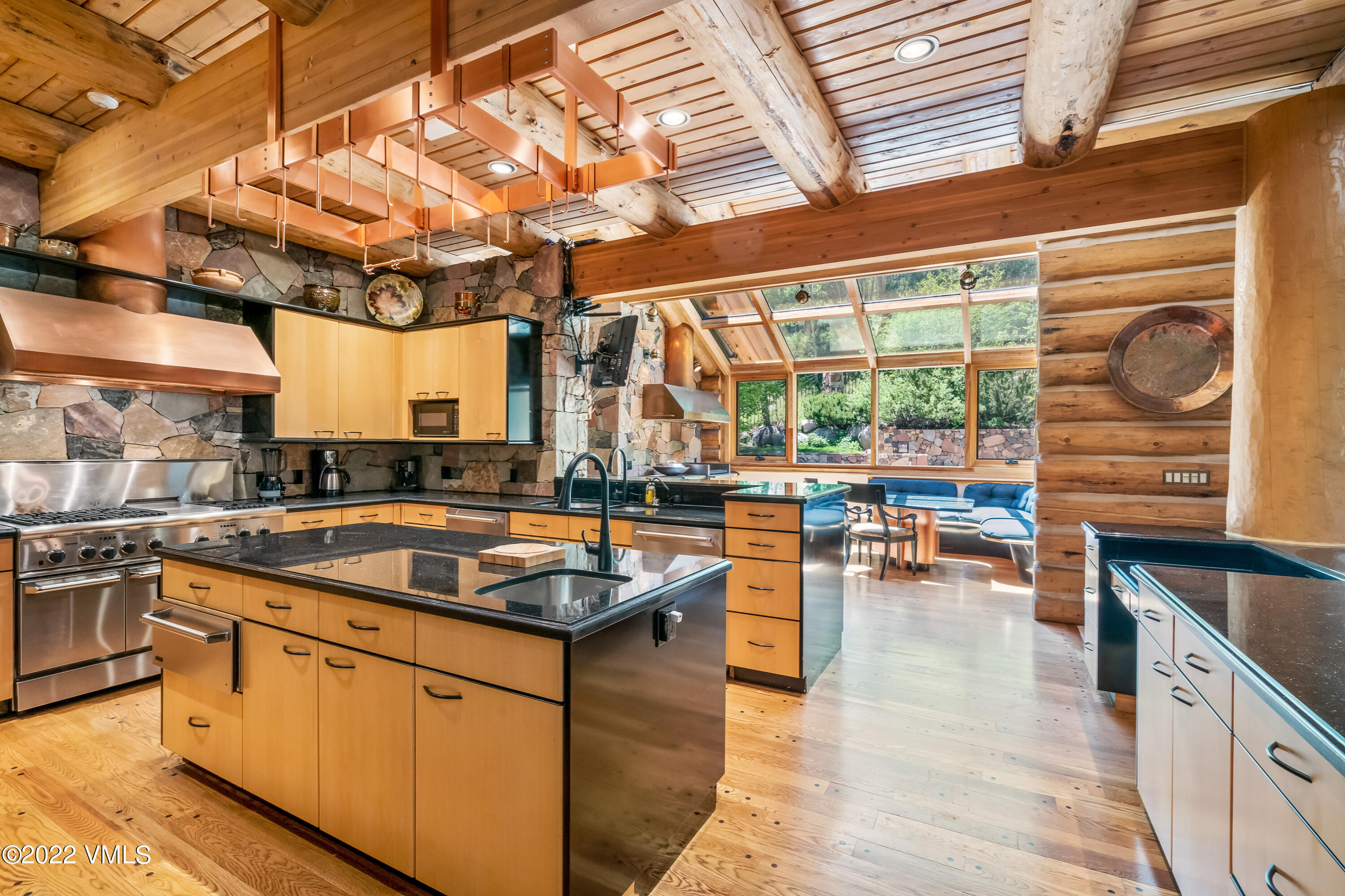 447 Borders Road Beaver Creek, CO 81620 - Photo 37 of 71 a kitchen with stainless steel appliances granite countertop a sink and cabinets