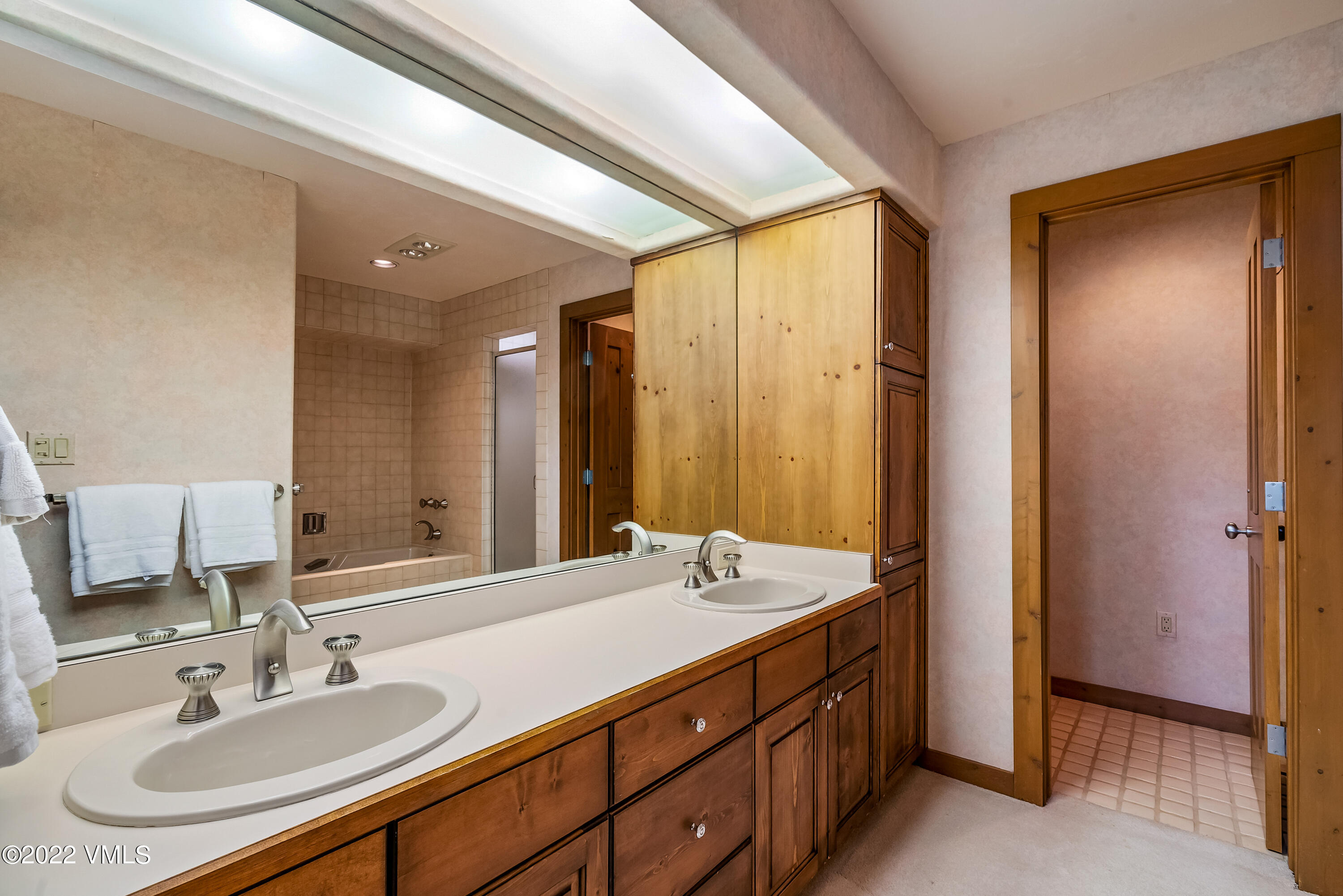 447 Borders Road Beaver Creek, CO 81620 - Photo 48 of 71 a bathroom with a double vanity sink and a mirror