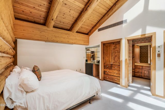 a picture of a bench in front of a wall