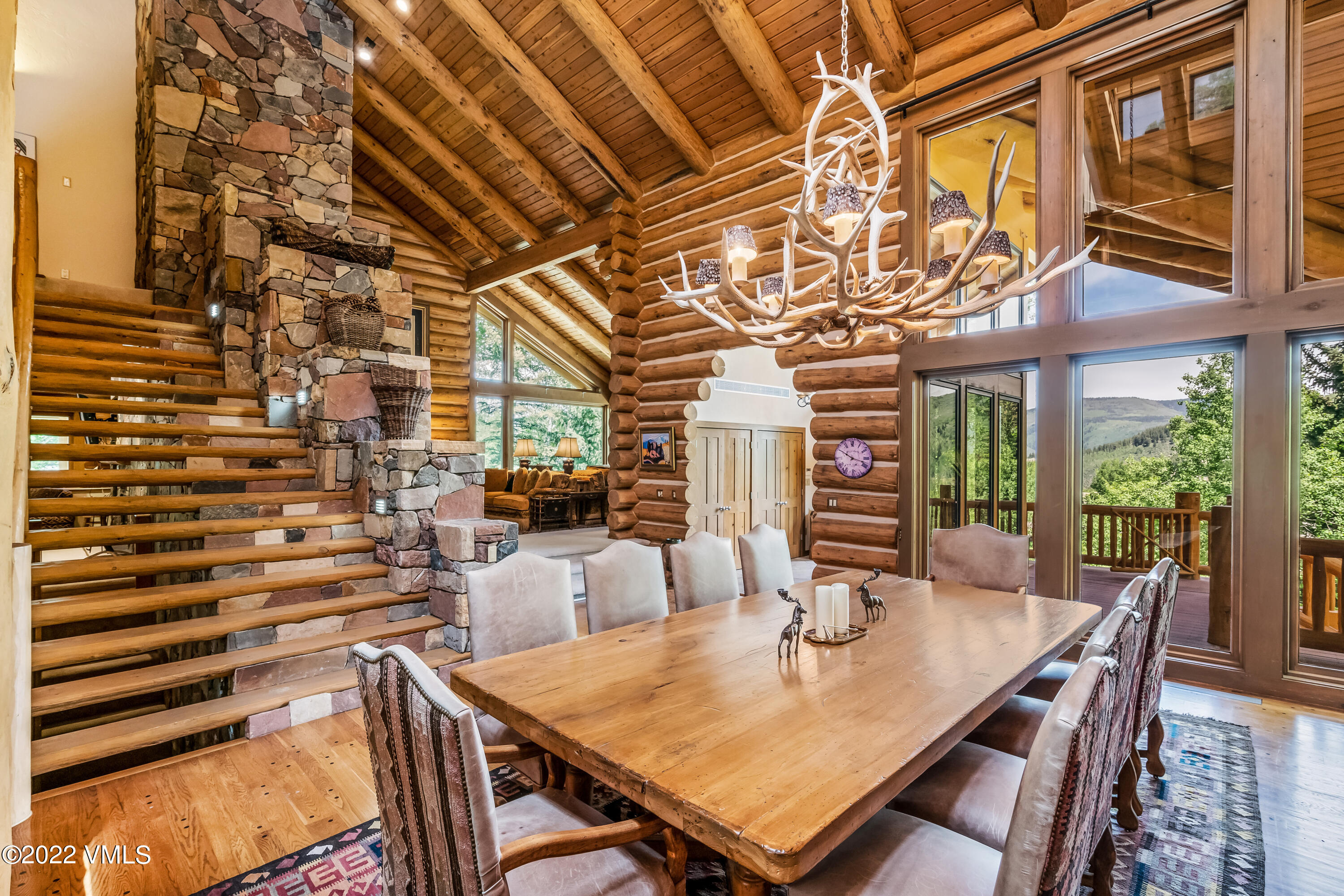 447 Borders Road Beaver Creek, CO 81620 - Photo 5 of 71 a view of a dining room with furniture a chandelier and wooden floor