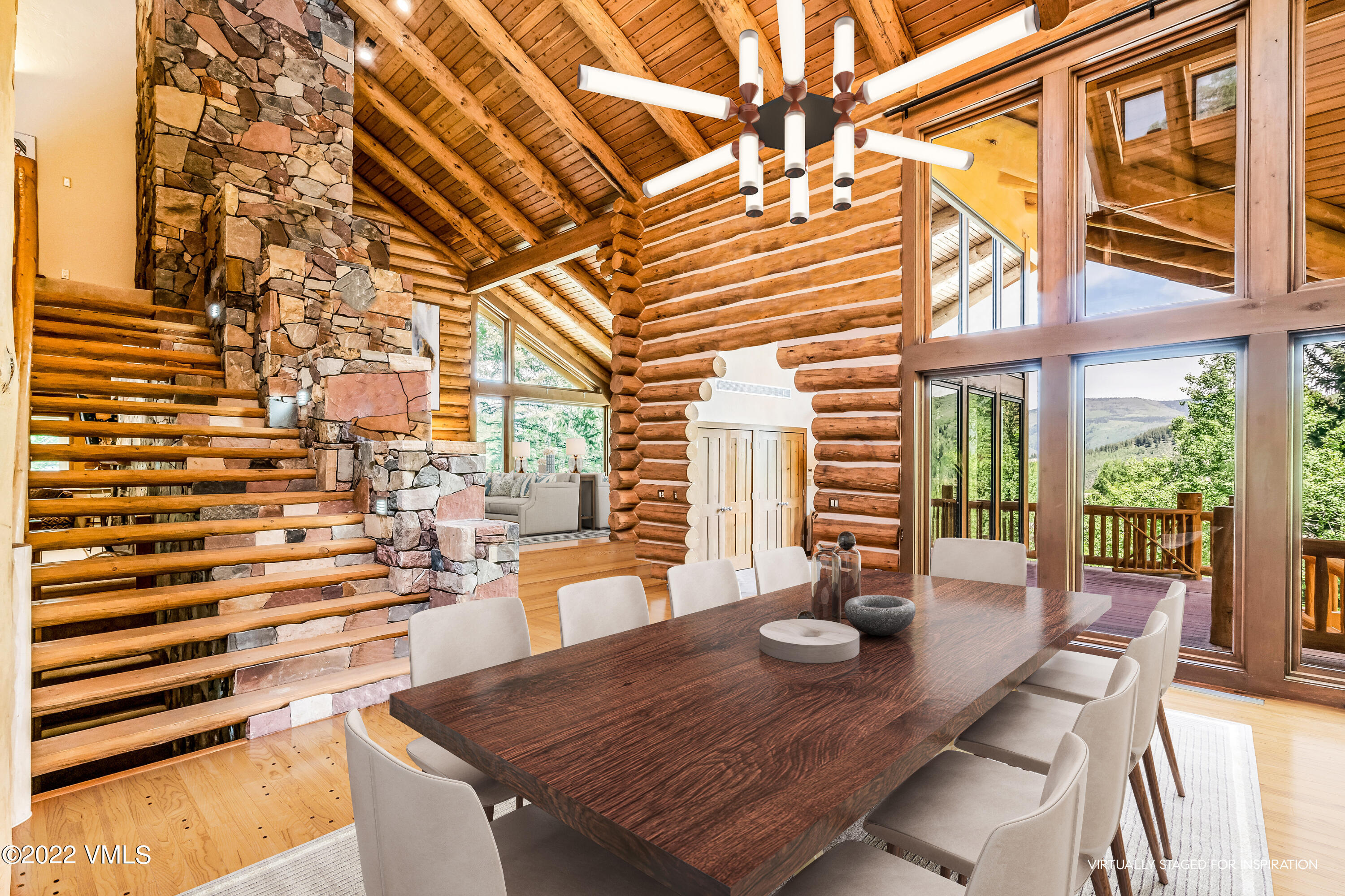 447 Borders Road Beaver Creek, CO 81620 - Photo 6 of 71 a view of a dining room with furniture and wooden floor