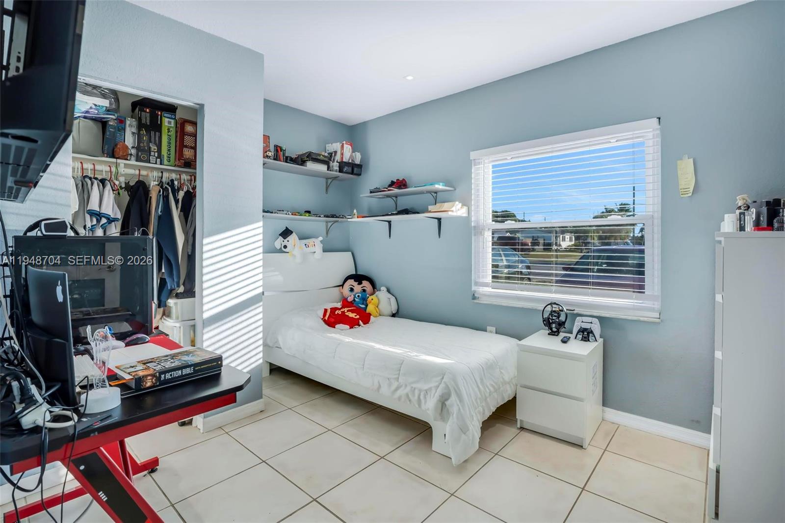 14860 Buchanan Street Miami, FL 33176 - Photo 12 of 27 a bedroom with baby bed and a window