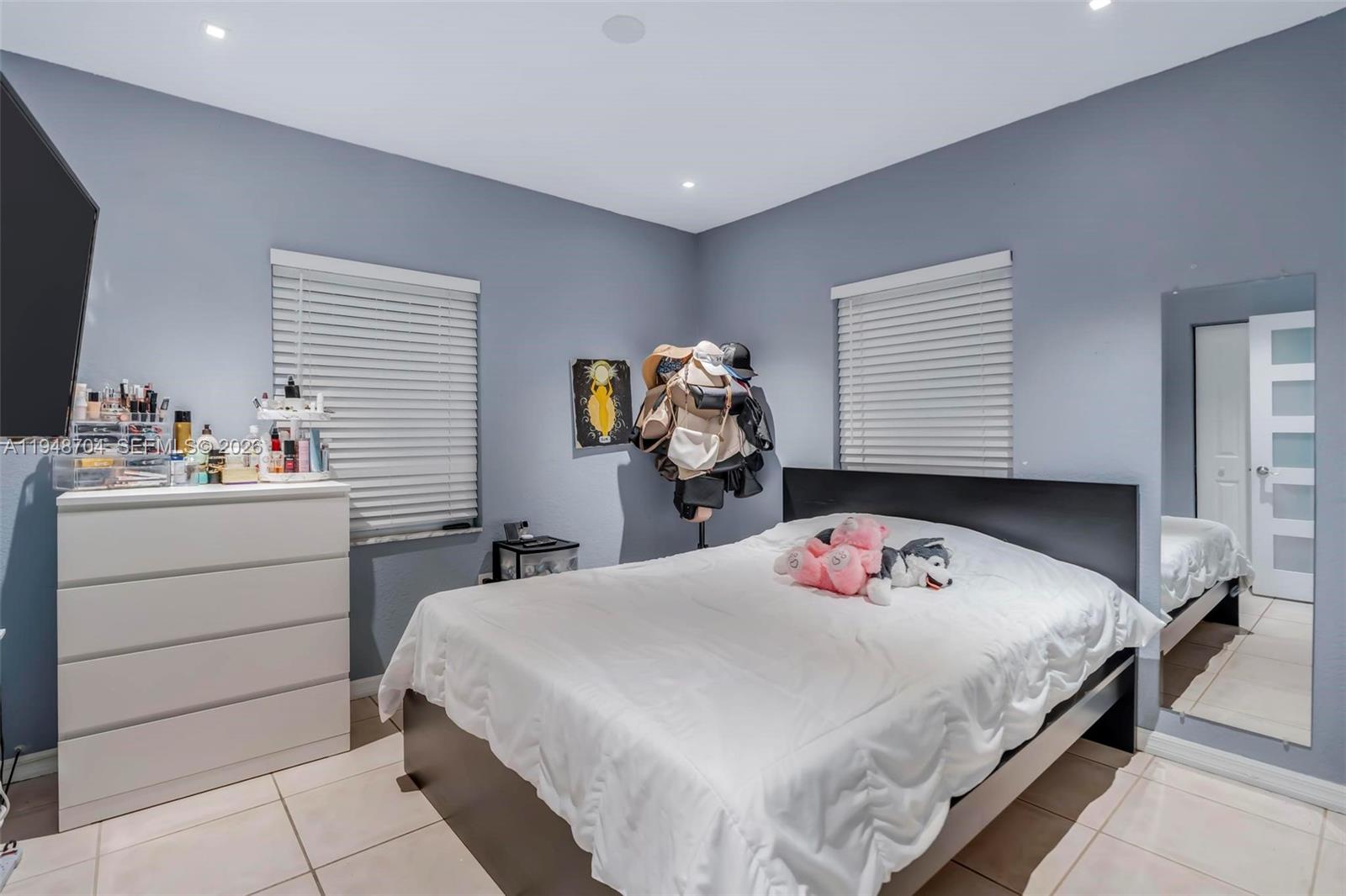 14860 Buchanan Street Miami, FL 33176 - Photo 13 of 27 a bedroom with a bed and dresser